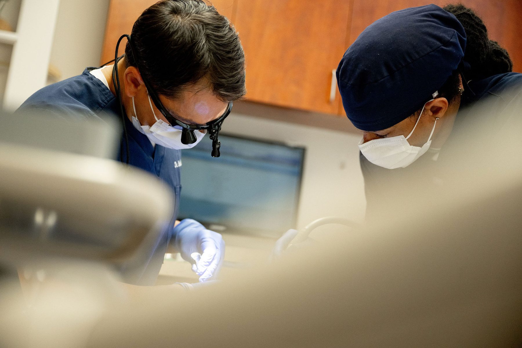 Precision Periodontics surgical team collaborating on a procedure